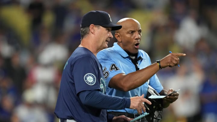 Seattle Mariners manager Scott Servais (9) talks with home plate umpire CB Bucknor (54) during the game against the Los Angeles Dodgers at Dodger Stadium on Aug 20.