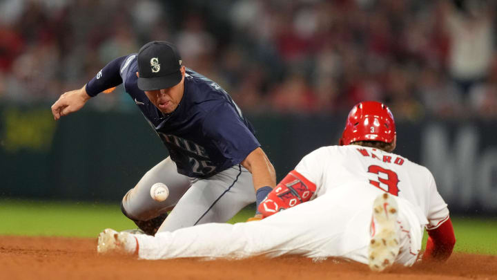 Los Angeles Angels left fielder Taylor Ward (3) slides into second base on a double against Seattle Mariners second baseman Dylan Moore (25) in the eighth inning at Angel Stadium on Aug 31.