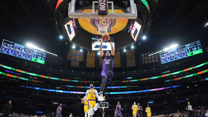 Nov 15, 2023; Los Angeles, California, USA; Sacramento Kings center JaVale McGee (00) dunks the ball against the Los Angeles Lakers in the second half at Crypto.com Arena. 