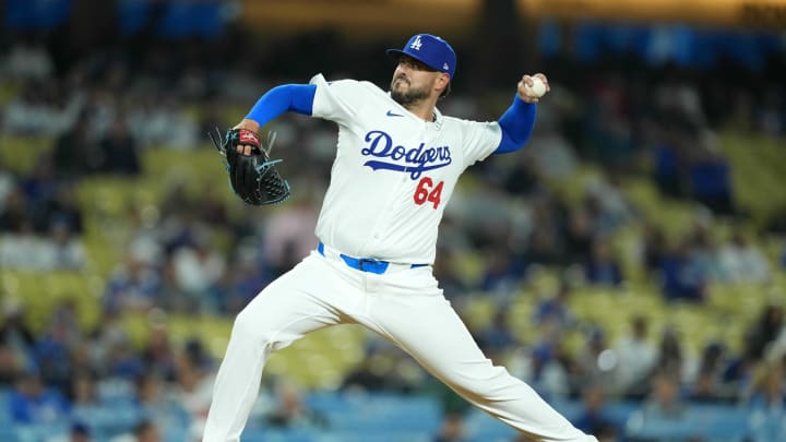 May 16, 2024; Los Angeles, California, USA; Los Angeles Dodgers pitcher Nick Ramirez (64) throws against the Cincinnati Reds  at Dodger Stadium. Mandatory Credit: Kirby Lee-USA TODAY Sports