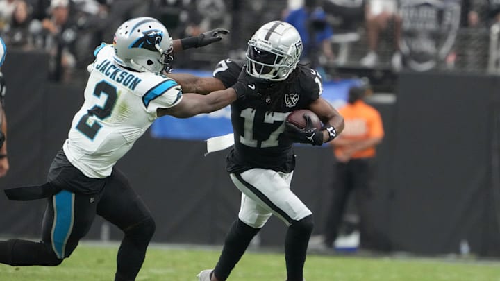 Sep 22, 2024; Paradise, Nevada, USA; Las Vegas Raiders wide receiver Davante Adams (17) carries the ball against Carolina Panthers cornerback Michael Jackson (2) in the first half at Allegiant Stadium. Sep 22, 2024; Paradise, Nevada, USA; Las Vegas Raiders wide receiver Davante Adams (17) carries the ball against Carolina Panthers cornerback Michael Jackson (2) in the first half at Allegiant Stadium.