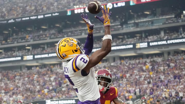 Sep 1, 2024; Paradise, Nevada, USA; LSU Tigers wide receiver Kyren Lacy (2) attempts to catch the ball against Southern California Trojans cornerback Jacobe Covington (14) at Allegiant Stadium. Mandatory Credit: Kirby Lee-Imagn Images