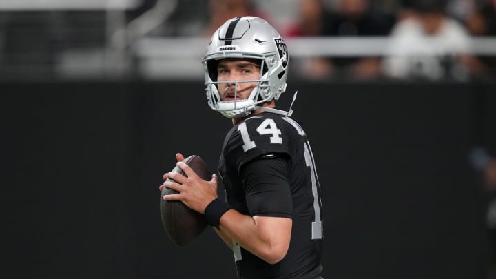 Aug 23, 2024; Paradise, Nevada, USA; Las Vegas Raiders quarterback Carter Bradley (14) throws the ball against the San Francisco 49ers at Allegiant Stadium. Mandatory Credit: Kirby Lee-USA TODAY Sports