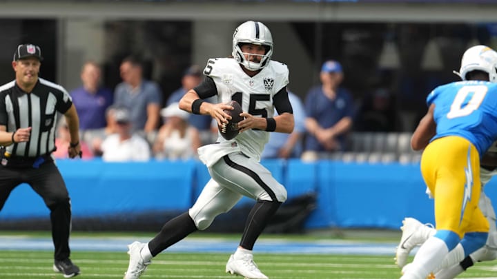 Sep 8, 2024; Inglewood, California, USA; Las Vegas Raiders quarterback Gardner Minshew (15) runs with the ball against the Los Angeles Chargers in the second half at SoFi Stadium. Mandatory Credit: Kirby Lee-Imagn Images