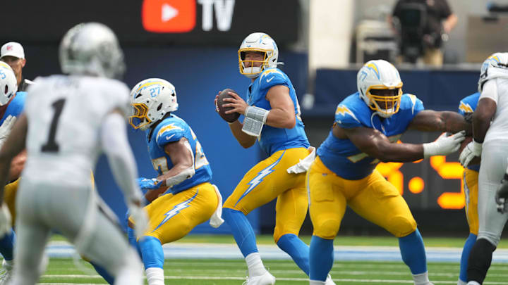 Sep 8, 2024; Inglewood, California, USA; Los Angeles Chargers quarterback Justin Herbert (10) throws the ball against the Las Vegas Raiders in the first half at SoFi Stadium. Mandatory Credit: Kirby Lee-Imagn Images