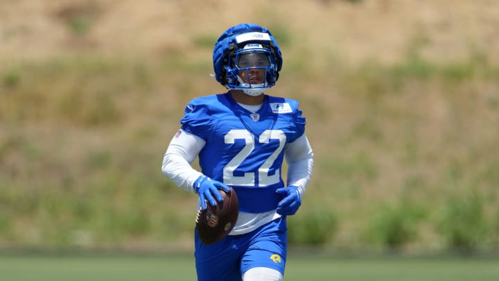 May 21, 2024, Thousand Oaks, California, USA; Los Angeles Rams running back Blake Corum (22) wears a Guardian helmet cap during organized team activities at Cal Lutheran University. Mandatory Credit: Kirby Lee-USA TODAY Sports