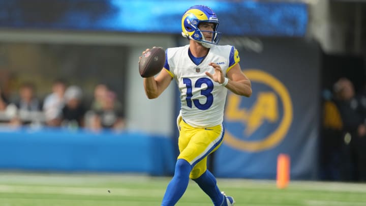 Aug 17, 2024; Inglewood, California, USA; Los Angeles Rams quarterback Stetson Bennett (13) throws the ball against the Los Angeles Chargers in the first half at SoFi Stadium. Mandatory Credit: Kirby Lee-USA TODAY Sports