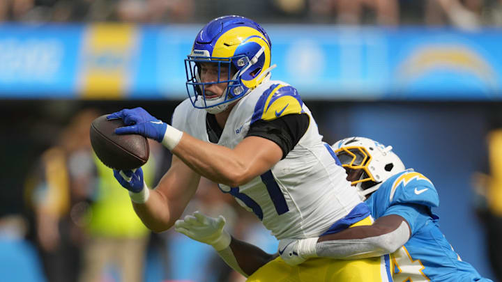 Aug 17, 2024; Inglewood, California, USA; Los Angeles Rams tight end Davis Allen (87) catches the ball against Los Angeles Chargers safety AJ Finley (24) in the first half at SoFi Stadium. Mandatory Credit: Kirby Lee-Imagn Images