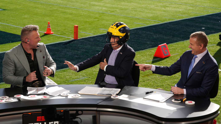 Jan 1, 2024; Pasadena, CA, USA; Pat McAfee (left), Lee Corso (center) and Kirk Herbstreit on the ESPN College Gameday set at the 2024 Rose Bowl college football playoff semifinal game at Rose Bowl. Mandatory Credit: Kirby Lee-USA TODAY Sports