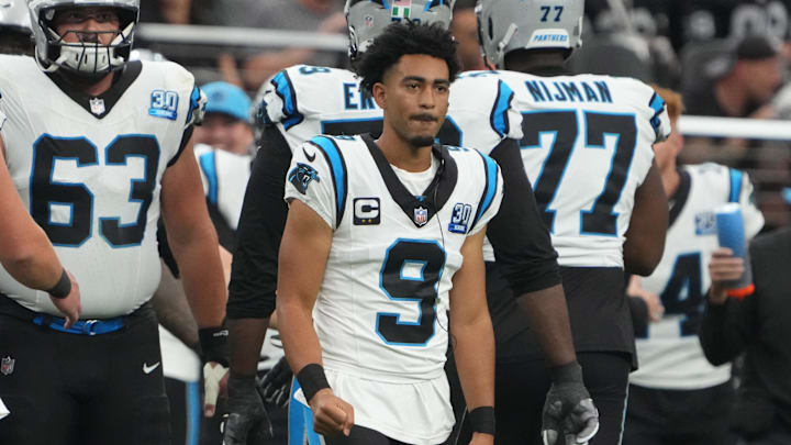 Young watches from the sidelines with Andy Dalton playing for the Panthers in Week 3. Young watches from the sidelines with Andy Dalton playing for the Panthers in Week 3.