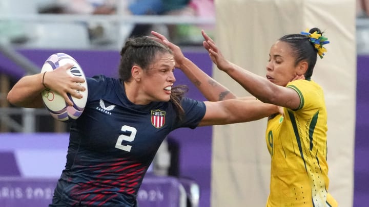 Jul 28, 2024; Paris Saint-Denis, France;  United States forward Ilona Maher (2) carries the ball against Brazil back Gabriela Lima (9) during the Paris 2024 Olympic Summer Games at Stade de France. Mandatory Credit: Kirby Lee-USA TODAY Sports