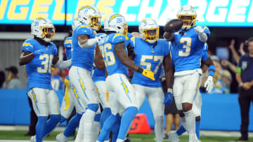 Oct 29, 2023; Inglewood, California, USA; Los Angeles Chargers safety Derwin James Jr. (3) celebrates with cornerback Asante Samuel Jr. (26) and linebacker Amen Ogbongbemiga (57) after intercepting a pass against the Chicago Bears in the second half at SoFi Stadium. Mandatory Credit: Kirby Lee-USA TODAY Sports