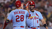 Sep 24, 2022; Los Angeles, California, USA;  St. Louis Cardinals third baseman Nolan Arenado (28) celebrates with designated hitter Albert Pujols (5) after hitting a two run home run against the Los Angeles Dodgers in the sixth inning at Dodger Stadium. Mandatory Credit: Kirby Lee-Imagn Images