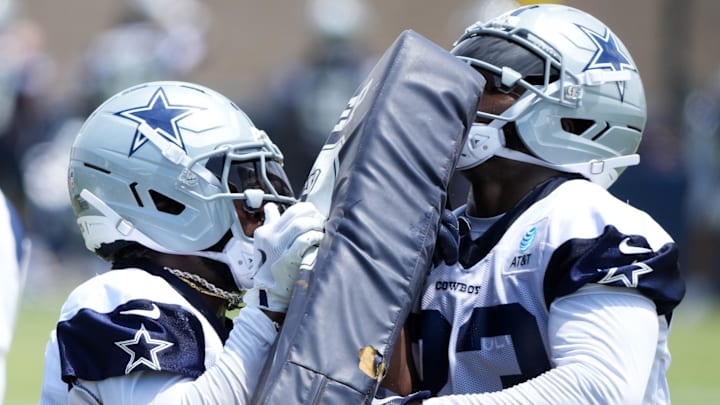 Dallas Cowboys running backs Miles Sanders and Javonte Williams participate in blocking drills during training camp Dallas Cowboys running backs Miles Sanders and Javonte Williams participate in blocking drills during training camp
