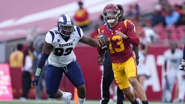 Southern California Trojans quarterback Caleb Williams (13) is pressured by Nevada Wolf Pack