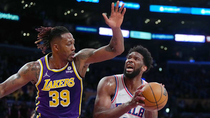 Mar 23, 2022; Los Angeles, California, USA; Philadelphia 76ers center Joel Embiid (21) shoots the ball against Los Angeles Lakers center Dwight Howard (39) in the first half at Crypto.com Arena. Mandatory Credit: Kirby Lee-Imagn Images