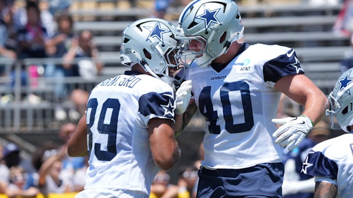Dallas Cowboys tight end Brevyn Spann-Ford and fullback Hunter Luepke celebrate after a touchdown at training camp at the River Ridge Fields. Dallas Cowboys tight end Brevyn Spann-Ford and fullback Hunter Luepke celebrate after a touchdown at training camp at the River Ridge Fields.