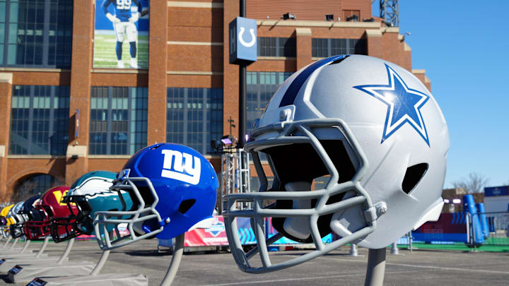 Feb 28, 2024; Indianapolis, IN, USA; A general view of large Dallas Cowboys and New York Giants helmets at the NFL Scouting Combine Experience at Lucas Oil Stadium. Mandatory Credit: Kirby Lee-Imagn Images