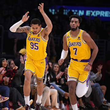 Jan 16, 2023; Los Angeles, California, USA; Los Angeles Lakers forward Juan Toscano-Anderson (95) and forward Troy Brown Jr. (7) react after a three-point basket ba Toscano-Anderson against the Houston Rockets in the first half at Crypto.com Arena. Mandatory Credit: Kirby Lee-Imagn Images