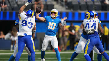 Aug 16, 2025; Inglewood, California, USA; Los Angeles Chargers quarterback Justin Herbert (10) throws the ball against the Los Angeles Rams in the first half at SoFi Stadium. Mandatory Credit: Kirby Lee-Imagn Images