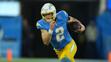 Dec 23, 2023; Inglewood, California, USA; Los Angeles Chargers quarterback Easton Stick (2) carries