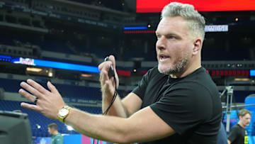 Pat McAfee watches workouts at the 2025 NFL Scouting Combine at Lucas Oil Stadium. 