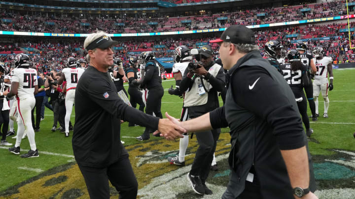 Oct 1, 2023; London, United Kingdom; Jacksonville Jaguars coach Doug Pederson (left) shakes hands