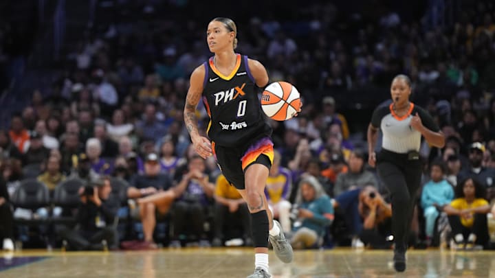 Phoenix Mercury guard Natasha Cloud (0) dribbles the ball against the LA Sparks in the first half at Crypto.com Arena.