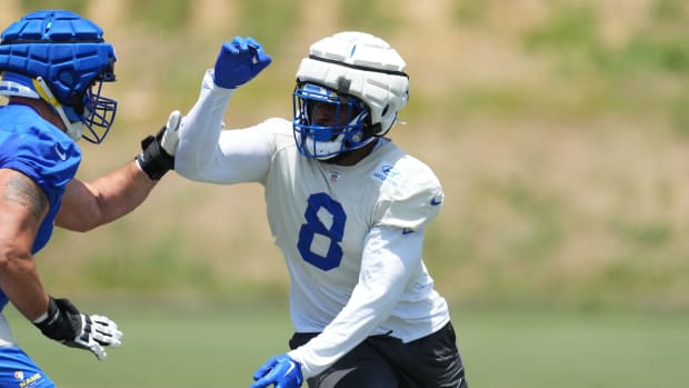 Los Angeles Rams defensive end Jared Verse (8) wears a Guardian helmet cap during organized team activities.