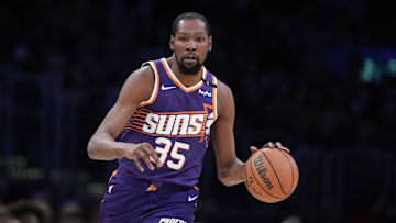 Mar 16, 2025; Los Angeles, California, USA; Phoenix Suns forward Kevin Durant (35) dribbles the ball against the Los Angeles Lakers in the second half at Crypto.com Arena. Mandatory Credit: Kirby Lee-Imagn Images
