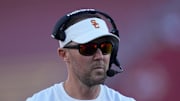 Oct 21, 2023; Los Angeles, California, USA; Southern California Trojans head coach Lincoln Riley watches from the sidelines against the Utah Utes in the first half at United Airlines Field at Los Angeles Memorial Coliseum. Mandatory Credit: Kirby Lee-Imagn Images