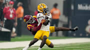 Sep 1, 2024; Paradise, Nevada, USA; LSU Tigers wide receiver Aaron Anderson (1) is tackled by Southern California Trojans safety Kamari Ramsey (7) in the first half at Allegiant Stadium. Mandatory Credit: Kirby Lee-Imagn Images