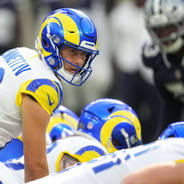 Aug 9, 2025; Inglewood, California, USA; Los Angeles Rams quarterback Stetson Bennett IV (13) takes the snap against the Dallas Cowboys in the first half at SoFi Stadium. Mandatory Credit: Kirby Lee-Imagn Images