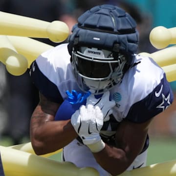 Jul 27, 2025; Oxnard, CA, USA; Dallas Cowboys running back Jaydon Blue (34) carries the ball at training camp at the River Ridge Fields. Mandatory Credit: Kirby Lee-Imagn Images