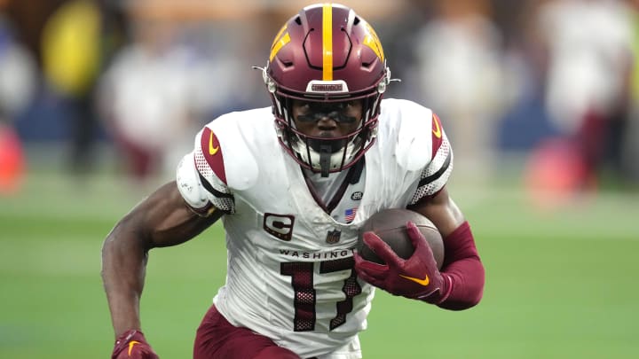 Dec 17, 2023; Inglewood, California, USA; Washington Commanders wide receiver Terry McLaurin (17) carries the ball against the Los Angeles Rams in the second half at SoFi Stadium. Mandatory Credit: Kirby Lee-USA TODAY Sports