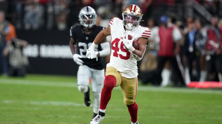 Aug 23, 2024; Paradise, Nevada, USA;  San Francisco 49ers running back Isaac Guerendo (49) carries the ball on a kickoff return against the Las Vegas Raiders in the first half at Allegiant Stadium. Mandatory Credit: Kirby Lee-USA TODAY Sports