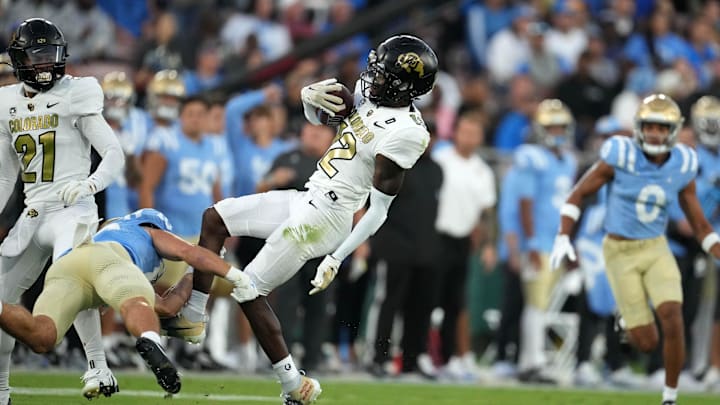 Oct 28, 2023; Pasadena, California, USA; Colorado Buffaloes cornerback Travis Hunter (12) intercepts a pass against the UCLA Bruins in the first half at Rose Bowl. Mandatory Credit: Kirby Lee-Imagn Images Oct 28, 2023; Pasadena, California, USA; Colorado Buffaloes cornerback Travis Hunter (12) intercepts a pass against the UCLA Bruins in the first half at Rose Bowl. Mandatory Credit: Kirby Lee-Imagn Images