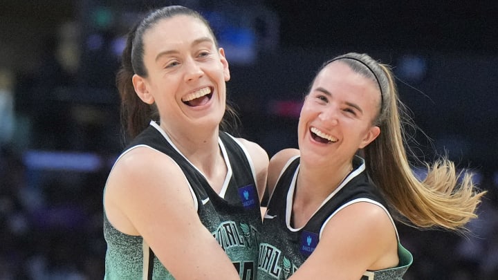 Aug 15, 2024; Los Angeles, California, USA; New York Liberty forward Breanna Stewart (30) and guard Sabrina Ionescu (20) celebrate in the first half against the LA Sparks Crypto.com Arena. 