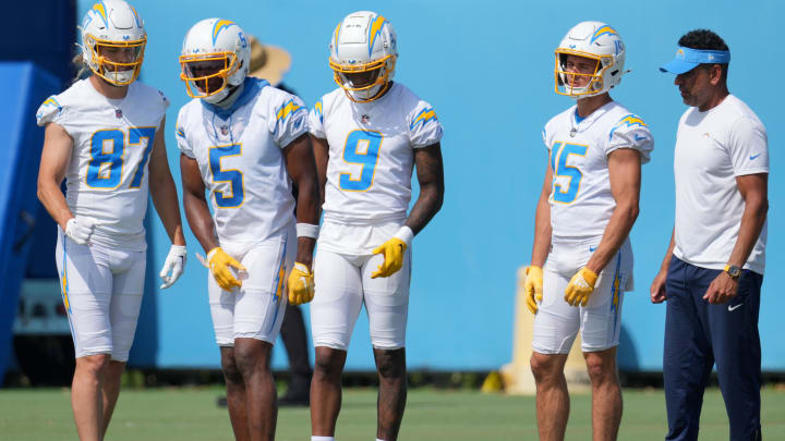 Jun 13, 2024; Costa Mesa, CA, USA; Los Angeles Chargers wide receivers coach Sanjay Lal (right) talks with wide receiver Simi Fehoko (87), Joshua Palmer (5), DJ Clark (9) and Ladd McConkey (15) during minicamp at the Hoag Performance Center. Mandatory Credit: Kirby Lee-USA TODAY Sports