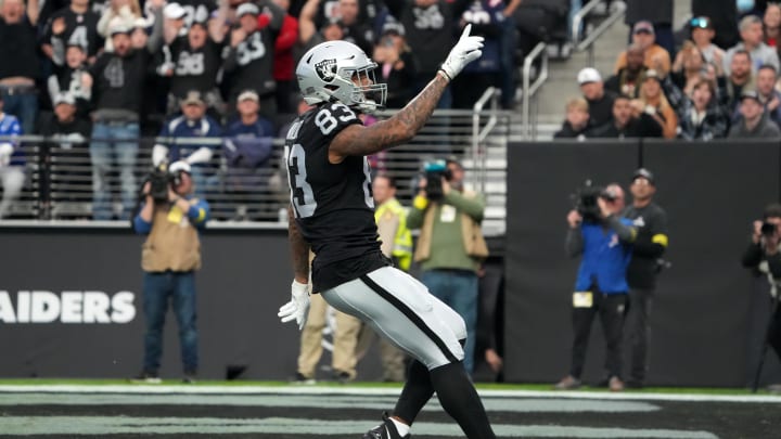 Dec 18, 2022; Paradise, Nevada, USA; Las Vegas Raiders tight end Darren Waller (83) scores on a 25-yard touchdown reception against the New England Patriots in the first half at Allegiant Stadium. The Raiders defeated the Patriots 30-24. Mandatory Credit: Kirby Lee-USA TODAY Sports