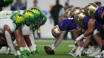 Dec 1, 2023; Las Vegas, NV, USA; Helmets of the Oregon Ducks and Washington Huskies at the line of scrimmage during the Pac-12 Championship game in the first half at Allegiant Stadium. Mandatory Credit: Kirby Lee-Imagn Images