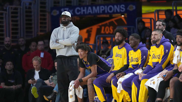 Mar 17, 2025; Los Angeles, California, USA; Los Angeles Lakers forward LeBron James watches from the bench against the San Antonio Spurs in the first half at Crypto.com Arena. Mandatory Credit: Kirby Lee-Imagn Images