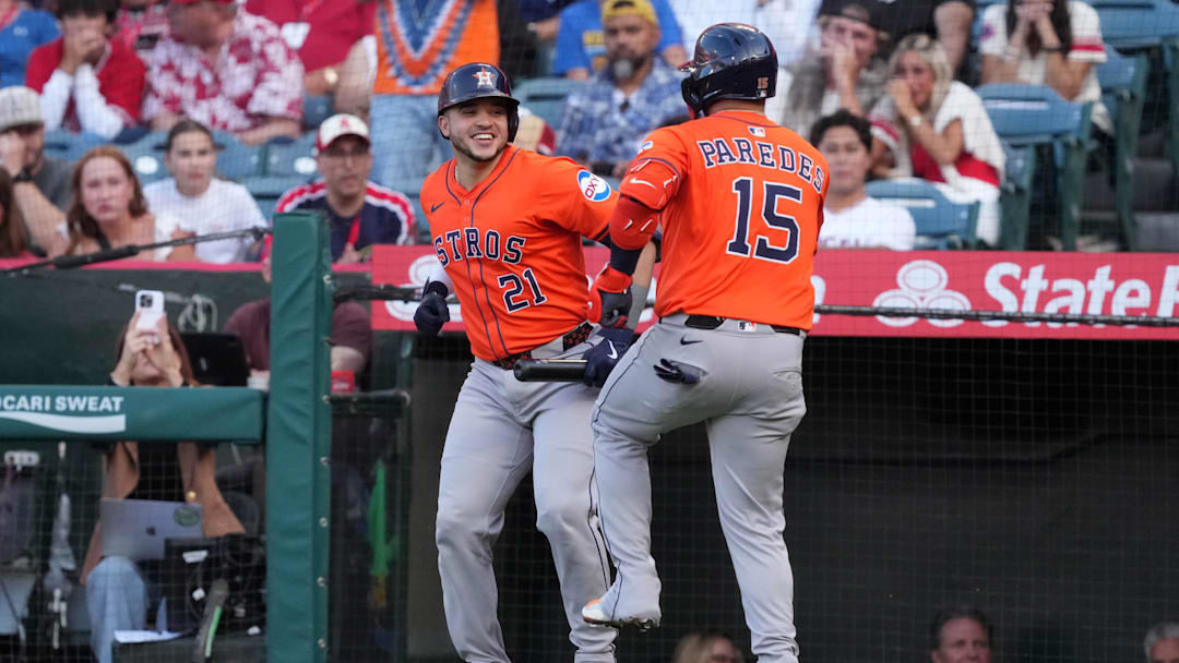 Jun 20, 2025; Anaheim, California, USA; Houston Astros third baseman Isaac Paredes (15) celebrates with catcher Yainer Diaz (21) after hitting a home run in the first inning against the Los Angeles Angels at Angel Stadium. Mandatory Credit: Kirby Lee-Imagn Images