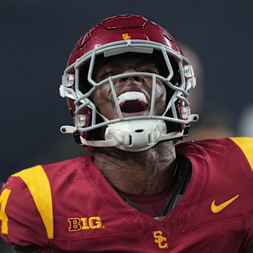 Sep 1, 2024; Paradise, Nevada, USA; Southern California Trojans running back Woody Marks (4) celebrates after scoring on a 13-yard touchdown run with eight seconds left against the LSU Tigers at Allegiant Stadium. Mandatory Credit: Kirby Lee-Imagn Images