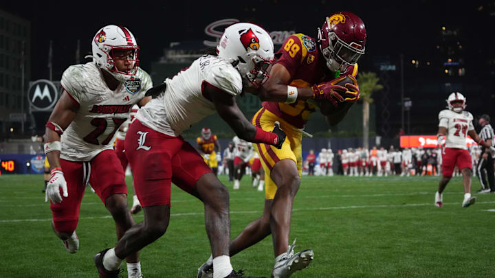 Dec 27, 2023; San Diego, CA, USA; Southern California Trojans wide receiver Ja'Kobi Lane (89) catches a touchdown pass against  (27) in the second half of the Holiday Bowl at Petco Park. Mandatory Credit: Kirby Lee-Imagn Images