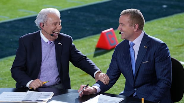 Lee Corso (left) and Kirk Herbstreit on the ESPN College Gameday set at the 2024 Rose Bowl college football playoff semifinal