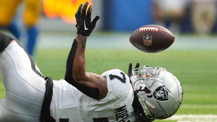 Sep 8, 2024; Inglewood, California, USA; Las Vegas Raiders safety Tre'von Moehrig (7) attempts to intercept a pass against the Los Angeles Chargers in the second half at SoFi Stadium. Mandatory Credit: Kirby Lee-Imagn Images