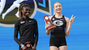 Jun 8, 2024; Eugene, OR, USA; Rose Yeboah of Illinois and Elena Kulichenko of Georgia pose after tying for first in the women's high jump at 6-5 1/2 (1.97m) during the NCAA Track and Field Championships at Hayward Field. Mandatory Credit: Kirby Lee-Imagn Images