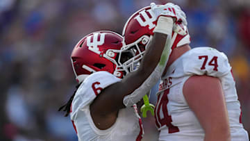 Indiana Hoosiers running back Justice Ellison (6) celebrates with offensive lineman Bray Lynch (74) after scoring on a 1-yard touchdown run in the first half against the UCLA Bruins at Rose Bowl.