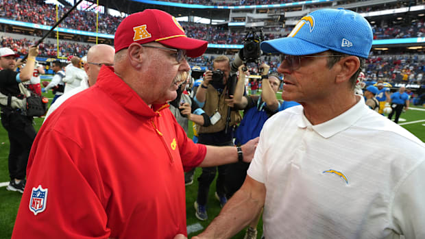 Chiefs coach Andy Reid shakes hands with Chargers coach Jim Harbaugh after the 2024 game at SoFi Stadium